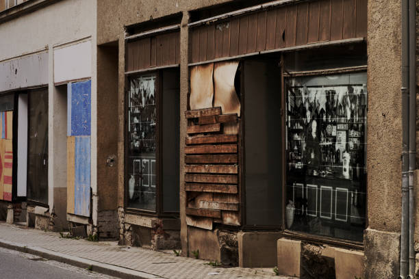 Derelict old store with boarded up windows