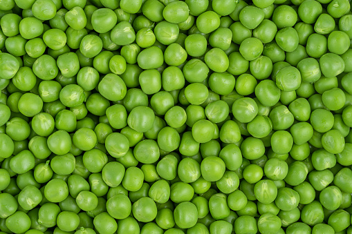 Green peas pattern, top view. Healthy vegetarian food. High quality photo