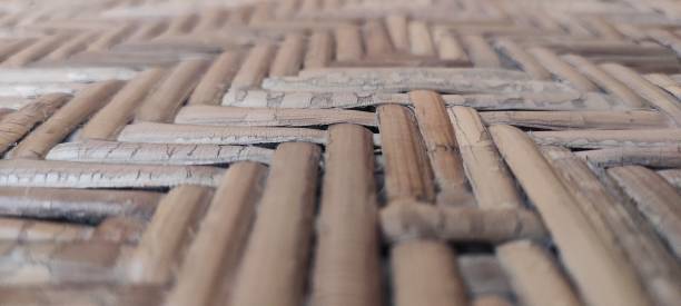 Woven Bamboo Defocused Background Indonesian traditional woven bamboo defocused background bamboo twist stock pictures, royalty-free photos & images