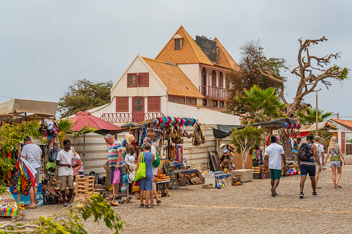 SANTA MARIA, CAPE VERDE, - JUNE 20.2022: Street view with people at souvenir shops in Santa Maria, Sal Island, Cape Verde