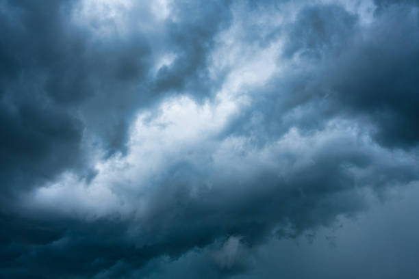 istock Moody dramatic blue sky and stormy cloud during thunderstorm 1408873711