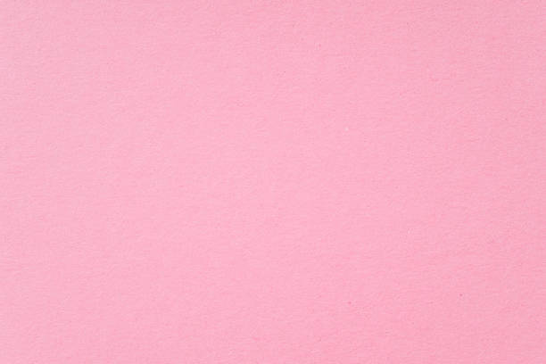 istock Smooth pink paper cardboard as texture, background, top view space for text 1408873755