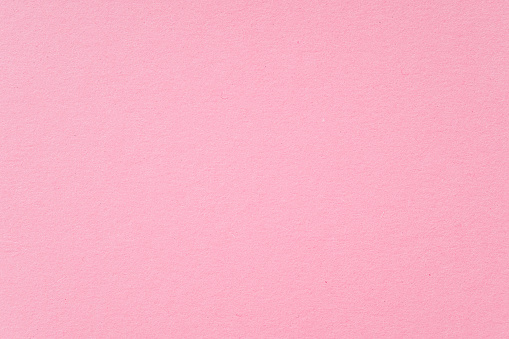 Smooth pink paper cardboard as texture, background, top view space for text