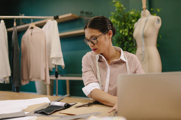 istock Fashion designer working in her studio 1408874287