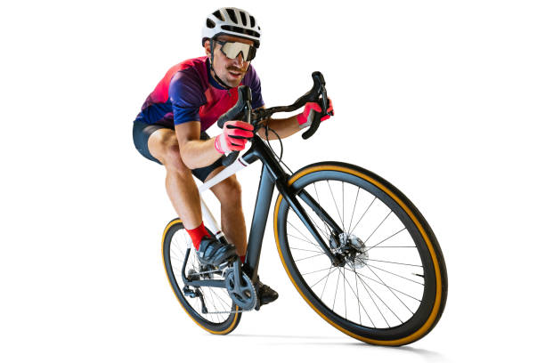 istock Portrait of man, professional cyclist training, riding isolated over white studio background. Concentration 1408874479