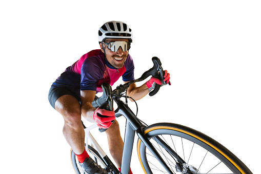 Portrait of man, professional cyclist training, riding isolated over white studio background. Cheerful sportsman. Concept of sport, action, motion, speed, hobby, lifestyle. Copy space for ad