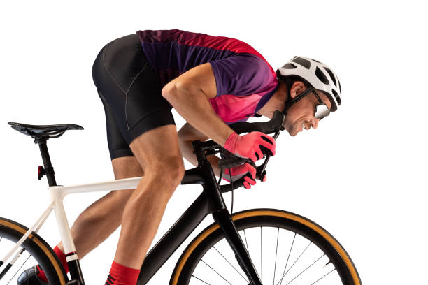 istock Portrait of man, professional cyclist training, riding isolated over white studio background. Championship 1408874484
