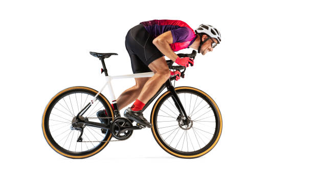 istock Portrait of man, professional cyclist training, riding isolated over white studio background. Side view 1408874493