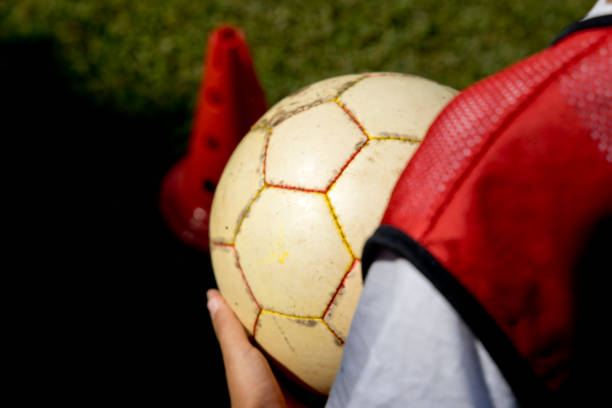 istock soccer ball stopped on the field ready to be kicked 1408879523