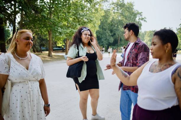 istock Friends walking in the park during summer 1408881221