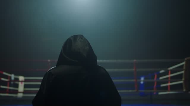 Boxer with ring robe walking towards ring