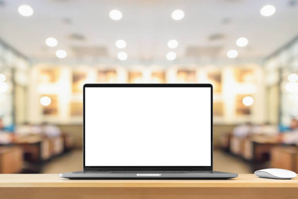 istock Laptop with blank screen on wood table with cafe coffee shop blur background 1408882628