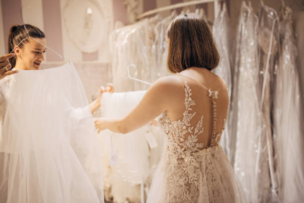 istock Bride choosing wedding dress veil 1408883405