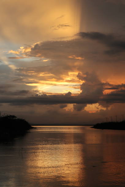 istock colorful dramatic sky with clouds at sunset. Sunset in  the lake 1408885133