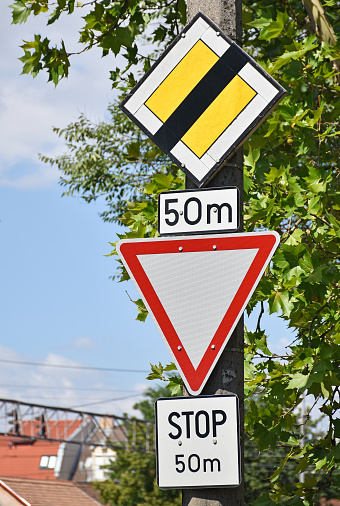 Crisis vs opportunity. White two street signs with arrow on metal pole with words. Directional road. Crossroads Road Sign, Two Arrow on blue sky background. Two way road sign with text.