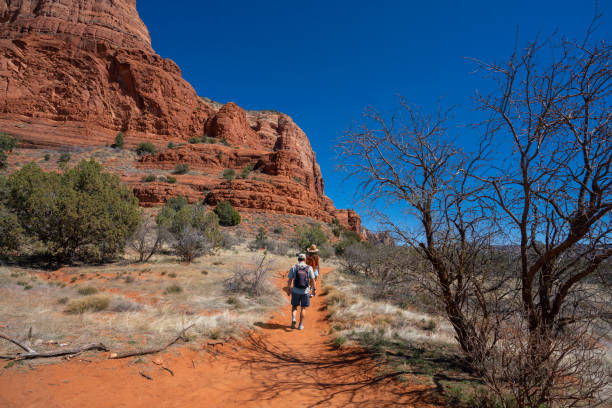istock Man on spring hiking trip in red mountains. 1408894739