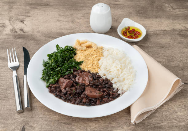 istock Typical brazilian feijoada with rice, pepper, farofa, kale and cracklings 1408895133