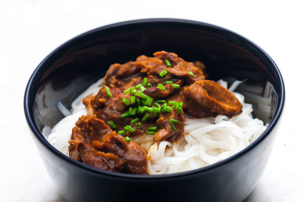 istock meat with sauce served with rice noodles 1408895319