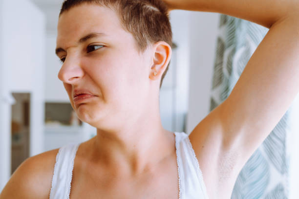 istock Teenage problems, sweat glands secrete an unpleasant odor under armpits. 1408904477