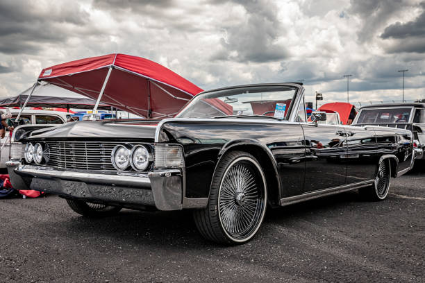 Lebanon, TN - May 14, 2022: Low perspective front corner view of a 1965 Lincoln Continental convertible at a local car show.
