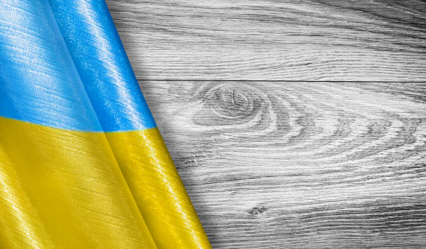 istock Wooden background with Ukraine flag with place for text. 1408908064