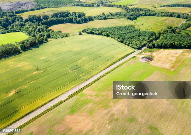 Road Through British Farmland Stock Photo - Download Image Now - Above, Aerial View, Agricultural Field