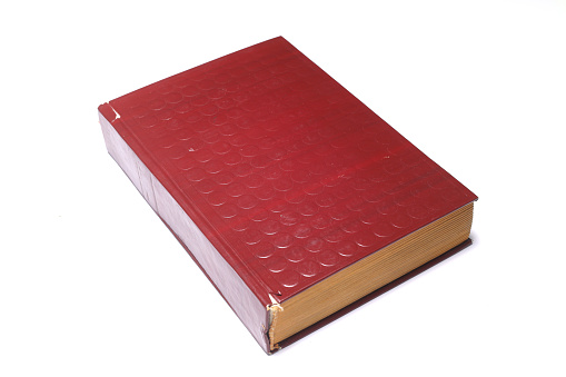 Old Red book isolated on white background. close up book.