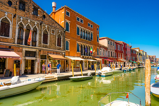 Murano, Venice - Italy July 6, 2022.View of village and canal in Murano. Venice, Italy