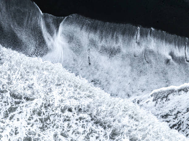 istock ocean waves on black sands beach abstract patterns in Iceland 1408913559