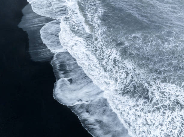 istock ocean waves on black sands beach abstract patterns in Iceland 1408913576