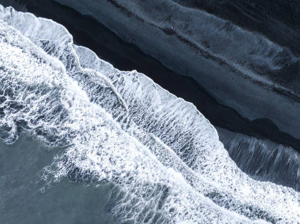 istock ocean waves on black sands beach abstract patterns in Iceland 1408913601