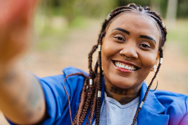 istock Afro woman taking a selfie 1408913602