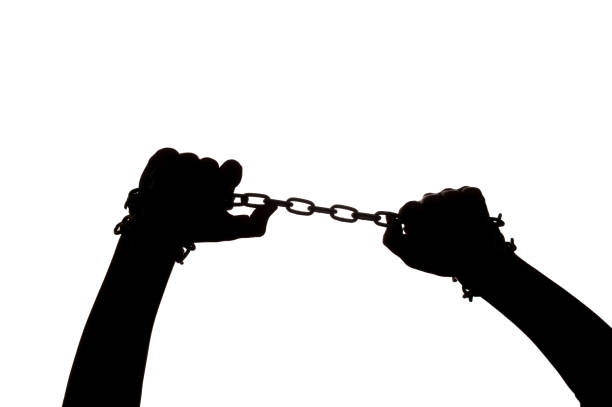 istock the silhouette of hands with chain 1408914626