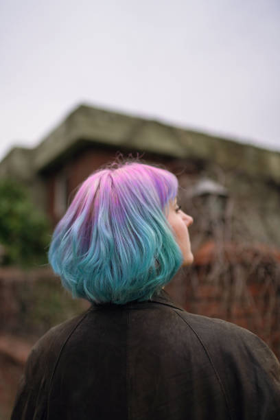 Portrait of stylish young girl with pink and blue ombre hair stock photo