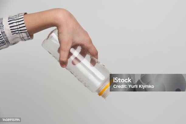 Human Hands Holding An Empty Bottle Stock Photo - Download Image Now - Empty, Insulated Drink Container, Balance