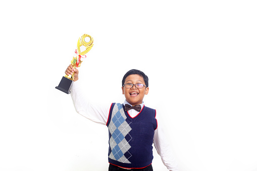 Successful asian student with trophy. Isolated on white background
