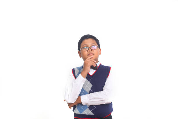 Little asian boy thinking an idea against white background