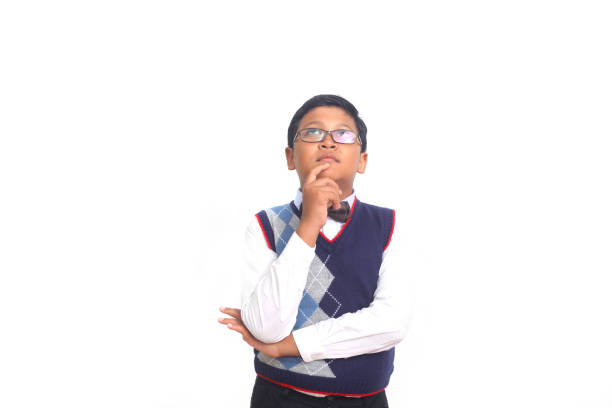 istock Little asian boy thinking an idea against white background 1408916335
