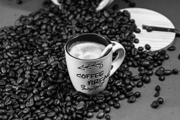 Black coffee cup, coffee beans. Breakfast coffee concept