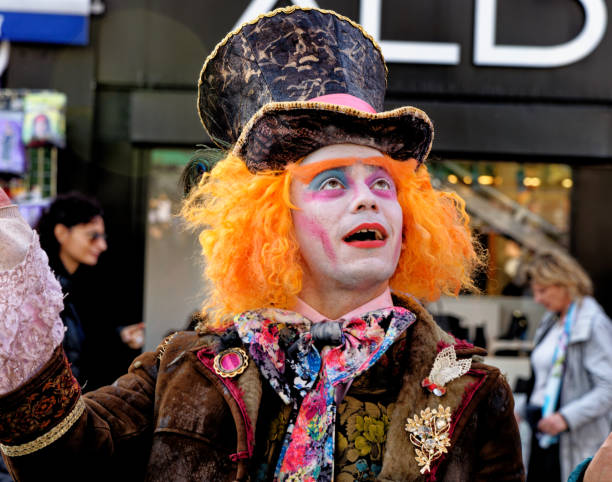 Athens, Greece - March, 2024. Disguised people in colourful costumes dance during the annual carnival parade at Metaxourgeio in Athens.