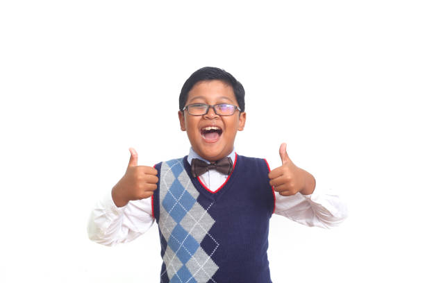 istock Asian school boy showing thumbs up. Isolated on white background 1408918344