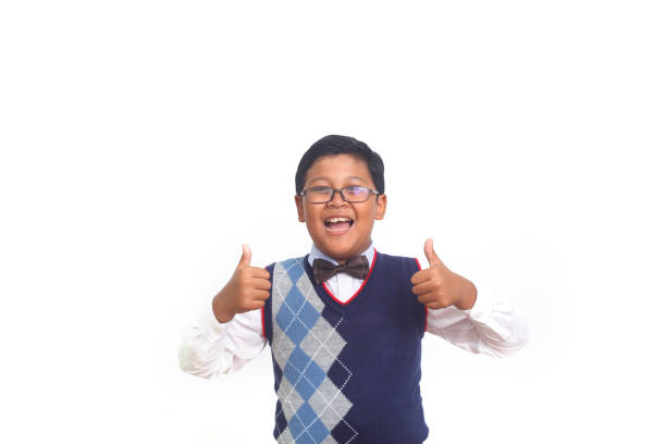 istock Asian school boy showing thumbs up. Isolated on white background 1408918366