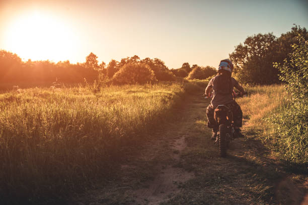 Teenager riding scooter. Boy on motorcycle