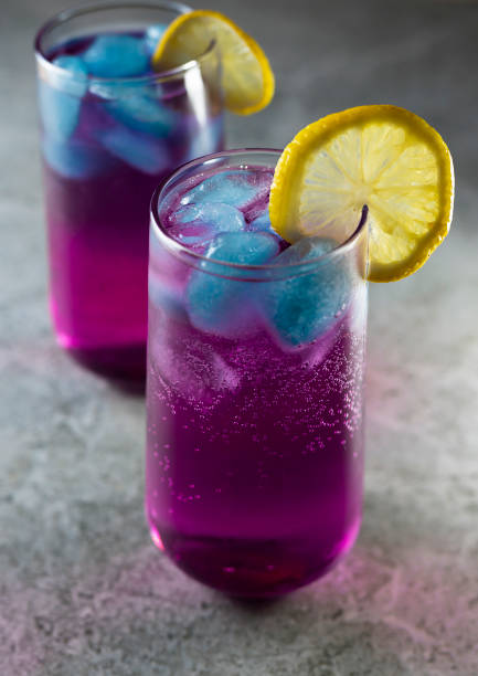 istock Bright refreshing cocktail. Pink lemonade with blue ice cubes. Galaxy lemonade. 1408920352