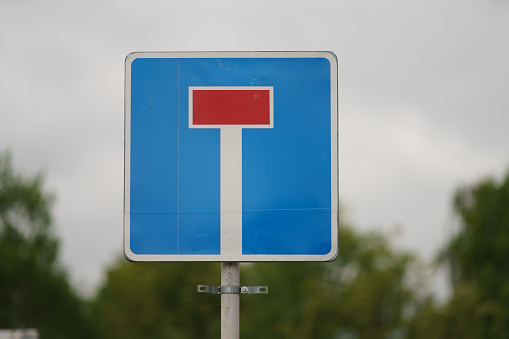 Empty signs on a roundabout.