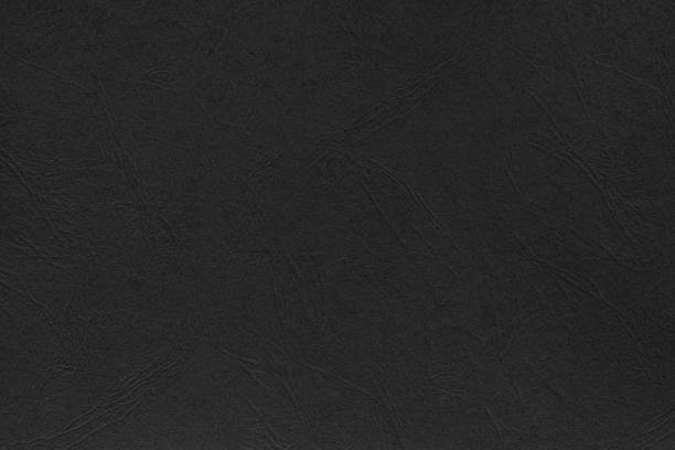 Black paper / cardboard texture background stock photo