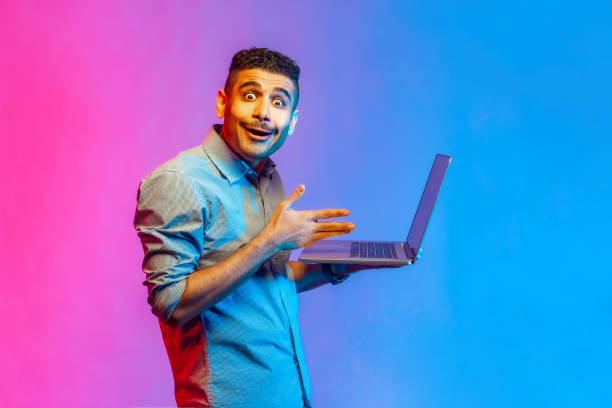 istock Man watching shocked video, having astonished facial expression, looking at camera with big eyes. 1408928491