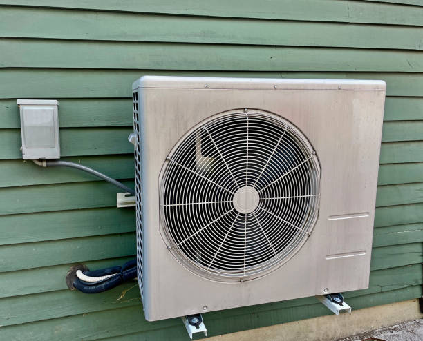 istock Air Conditioning (AC) Units Beside House 1408931832