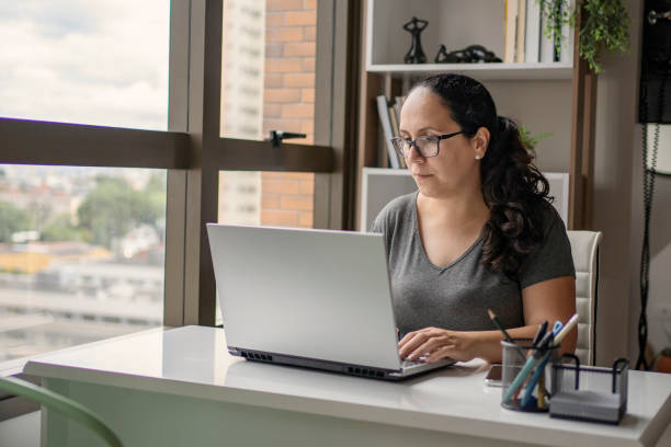 istock Young woman studying at home. Online learning concept. 1408933860