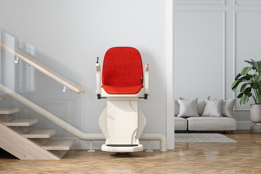 Front View Of Automatic Stair Lift On Staircase In Modern House